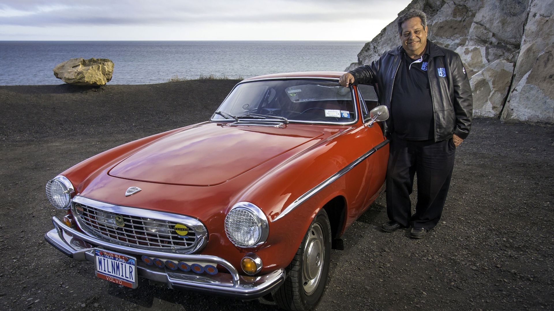 Volvo P1800S and proud owner Irv Gordon