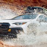 White 2024 Subaru Crosstrek Wilderness Going Through Water